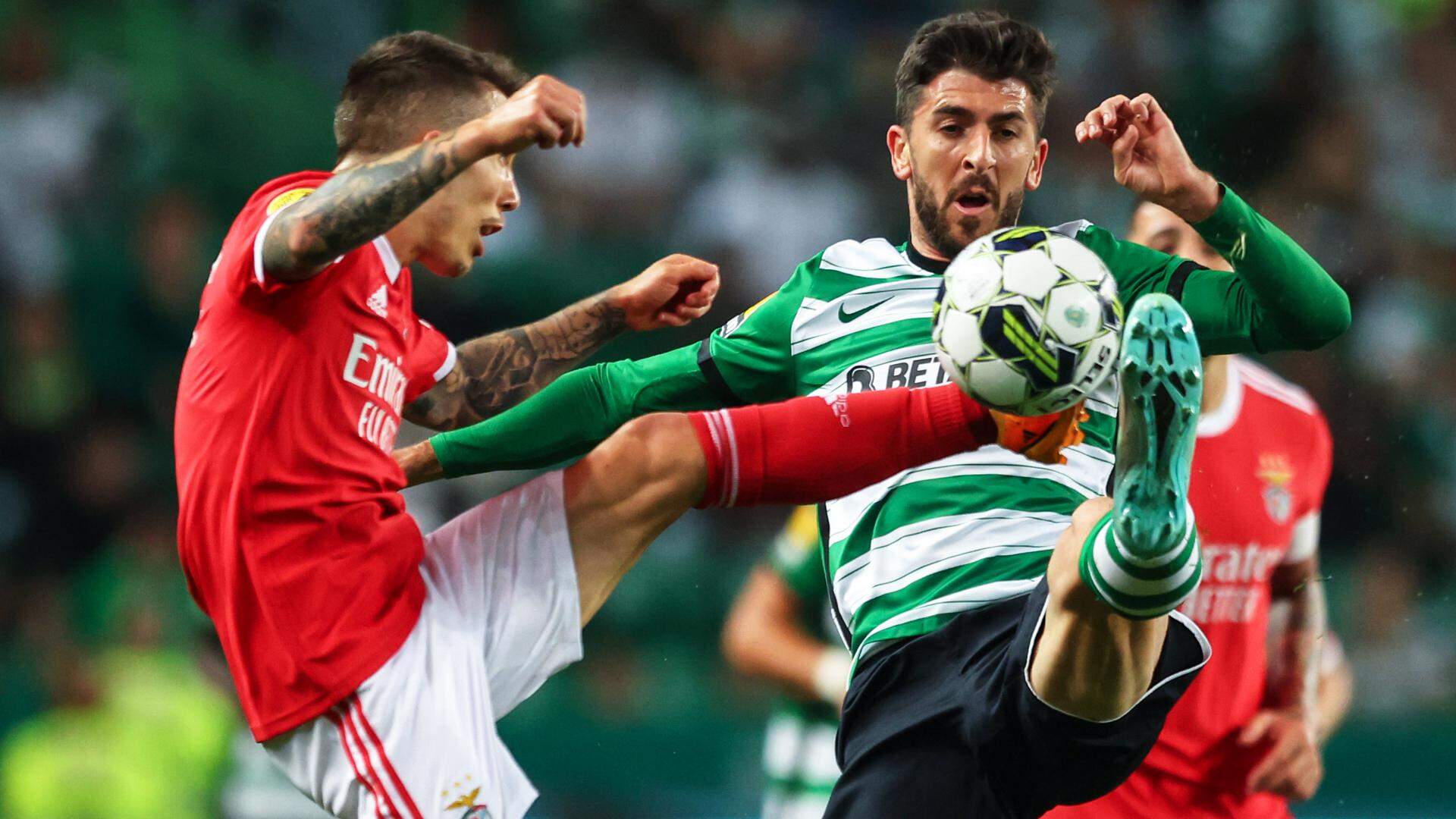 Sporting's CP Paulinho (R) in action against SL Benfica's Alex Grimaldo (L), during the Portuguese First League soccer match between Sporting CP vs SL Benfica, at Alvalade stadium in Lisbon, Portugal, 21 May 2023. NUNO VEIGA/LUSA