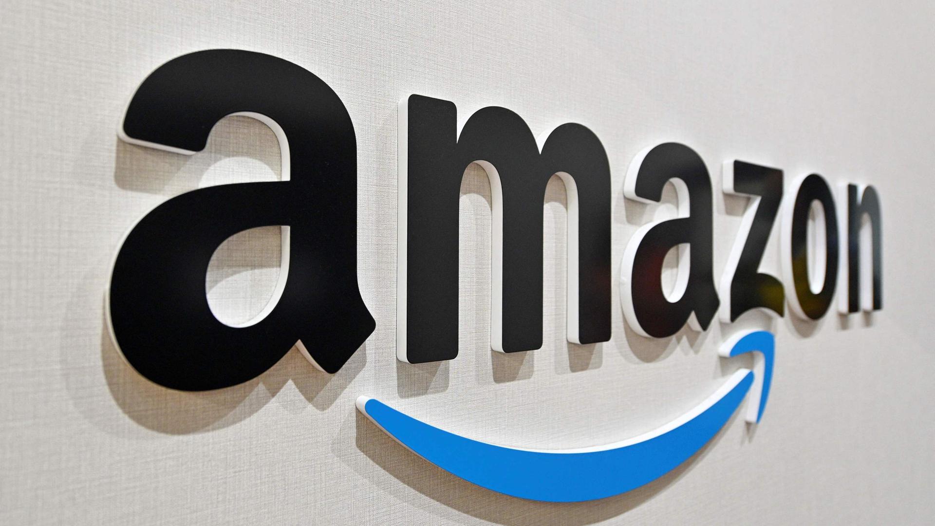 (FILES) In this file photo taken on July 04, 2022 This picture taken on July 4, 2022 shows the Amazon logo, a major online shopping company, at Amazon Amagasaki Fulfillent Center in Amagasaki, Hyogo prefecture. - Amazon CEO Andy Jassy said March 20, 2023 he was cutting 9,000 more jobs from the online retail giant's workforce, following the 18,000 that were axed in January. (Photo by Kazuhiro NOGI / AFP)