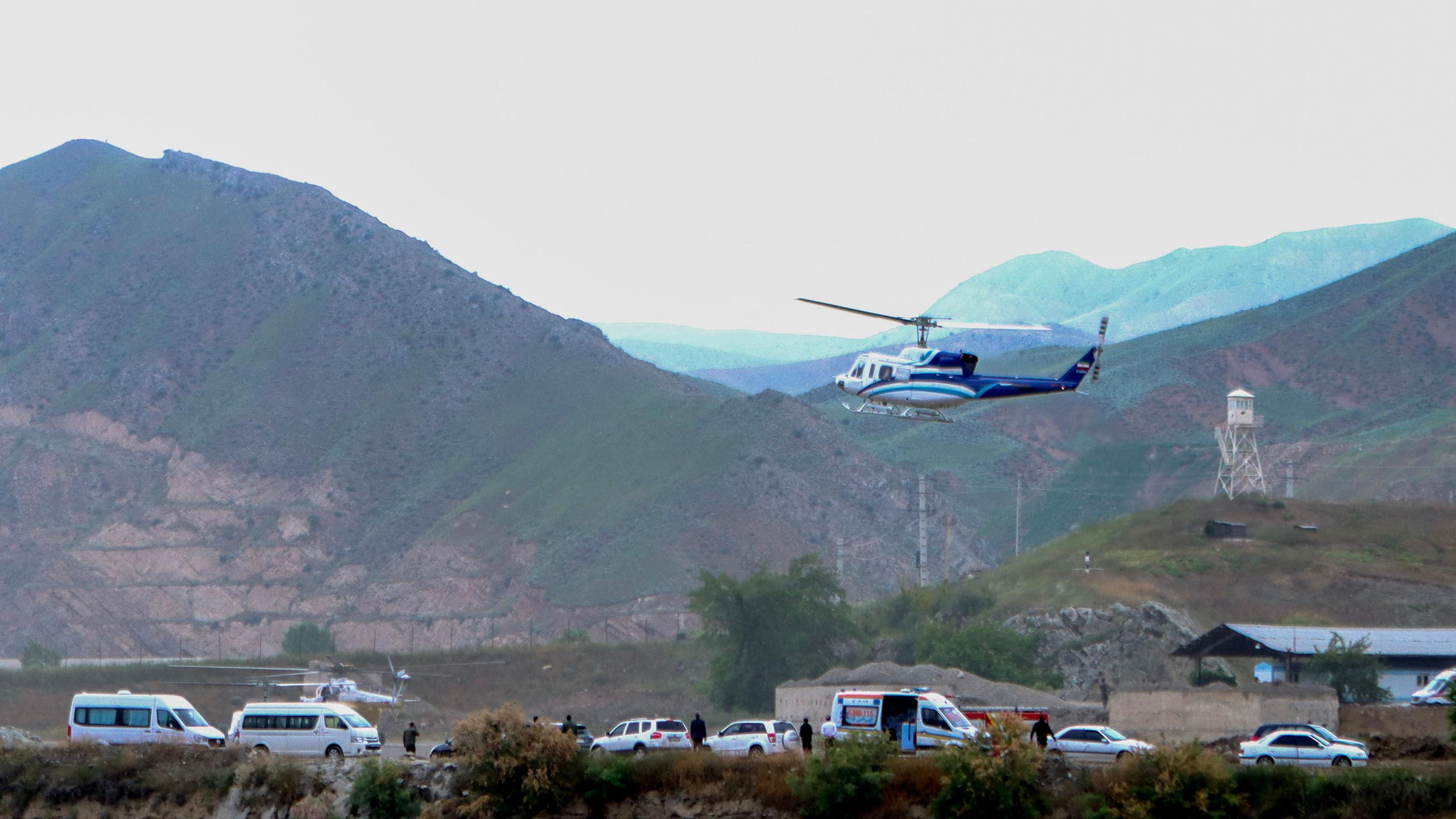 In this photo provided by Islamic Republic News Agency IRNA on May 19, 2024, shows the helicopter carrying Iran's President Ebrahim Raisi taking off at the Iranian border with Azerbaijan after the inauguration of the dam of Qiz Qalasi, in Aras. A helicopter in the convoy of the Iranian president was involved in "an accident" in East Azerbaijan province on May 19, state televsion reported, without specifying if the president was on board. (Photo by Ali Hamed HAGHDOUST / IRNA / AFP)