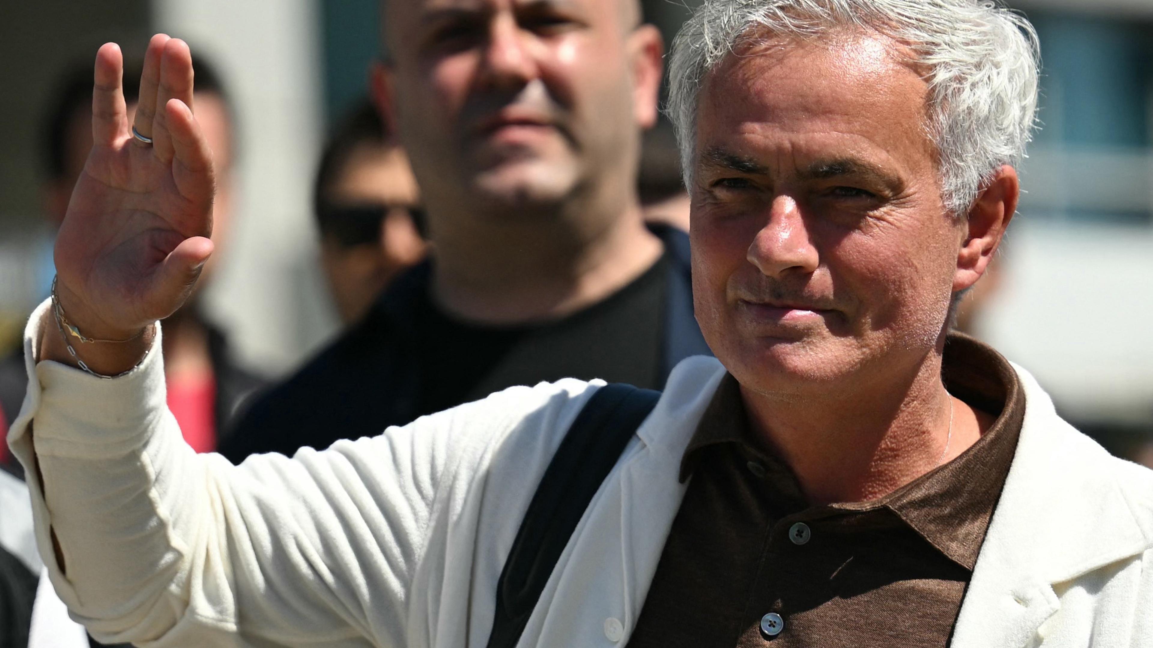 New coach of Turkish club Fenerbahce Jose Mourinho waves to fans upon his arrival in Istanbul on June 2, 2024. Two-time Champions League winning Jose Mourinho will be the new coach of Turkish club Fenerbahce, he announced on June 1. The Portuguese coach, who won the Champions League with Porto and Inter Milan, has not worked since he was sacked by Italian Serie A side Roma in January 2024. (Photo by OZAN KOSE / AFP)