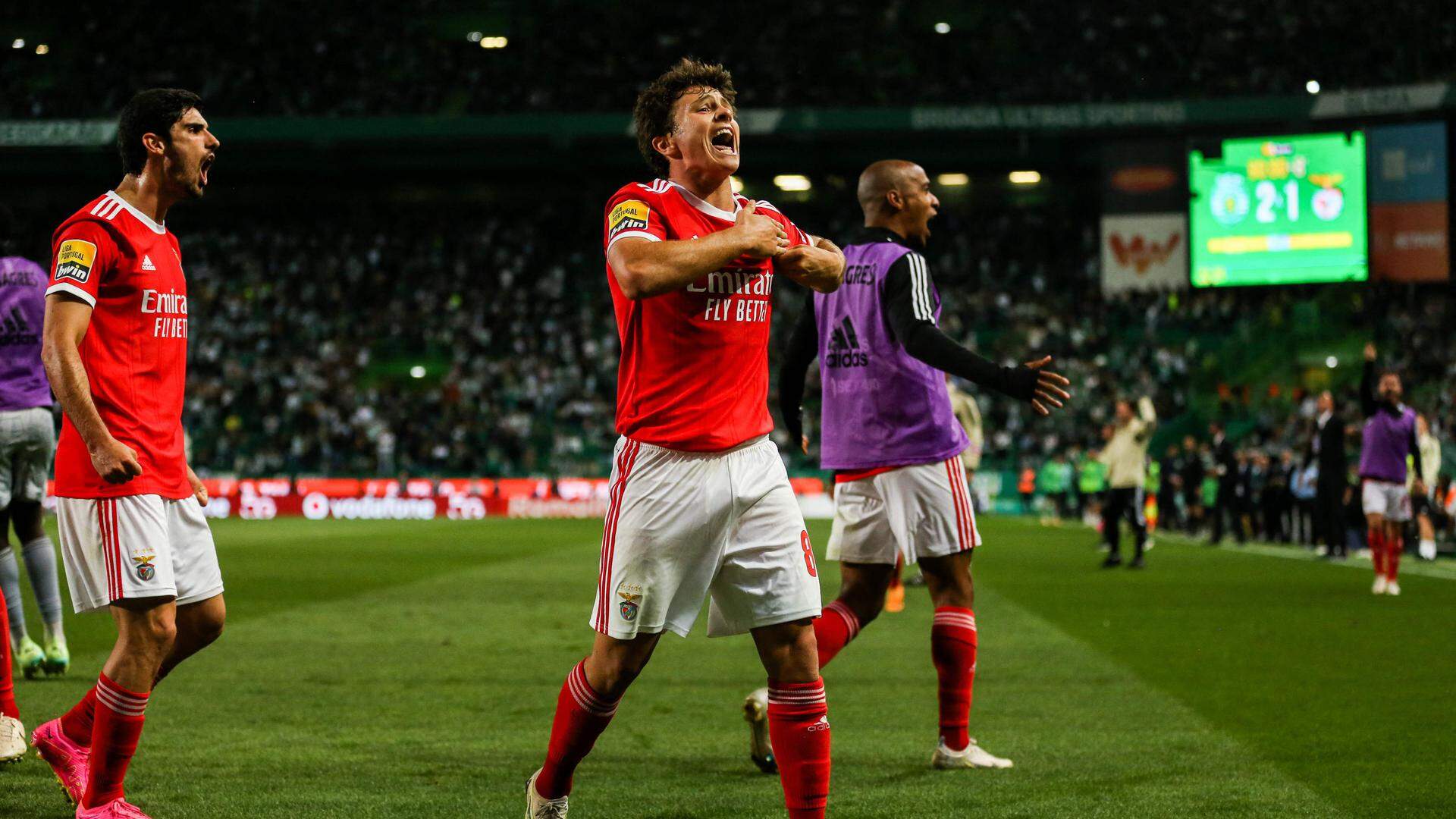 Benfica's Portuguese midfielder Joao Neves celebrates scoring the equalizing goal during the Portuguese league football match between Sporting CP and SL Benfica at the Jose Alvalade stadium in Lisbon on May 21, 2023. (Photo by CARLOS COSTA / AFP)