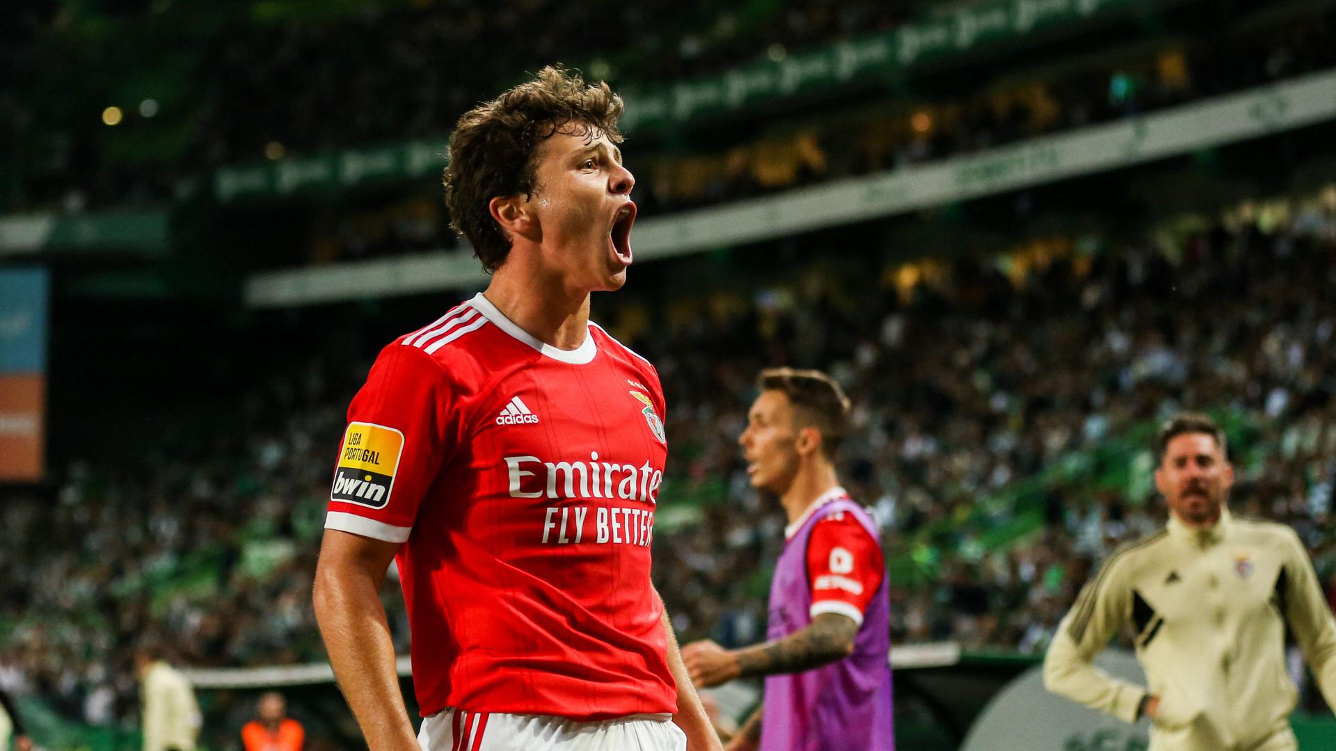 Benfica's Portuguese midfielder Joao Neves celebrates scoring the equalizing goal during the Portuguese league football match between Sporting CP and SL Benfica at the Jose Alvalade stadium in Lisbon on May 21, 2023. (Photo by CARLOS COSTA / AFP)