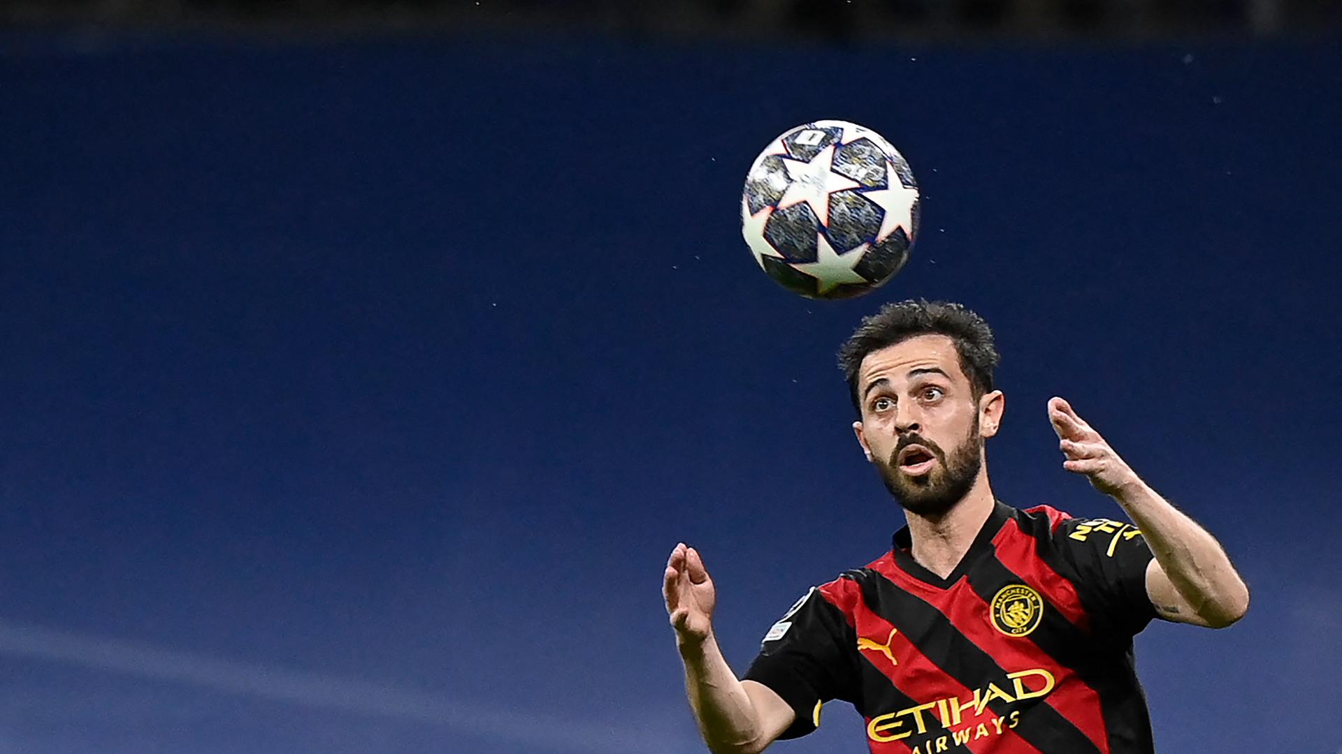 TOPSHOT - Manchester City's Portuguese midfielder Bernardo Silva eyes the ball during the UEFA Champions League semi-final first leg football match between Real Madrid CF and Manchester City at the Santiago Bernabeu stadium in Madrid on May 9, 2023. (Photo by OSCAR DEL POZO / AFP)
