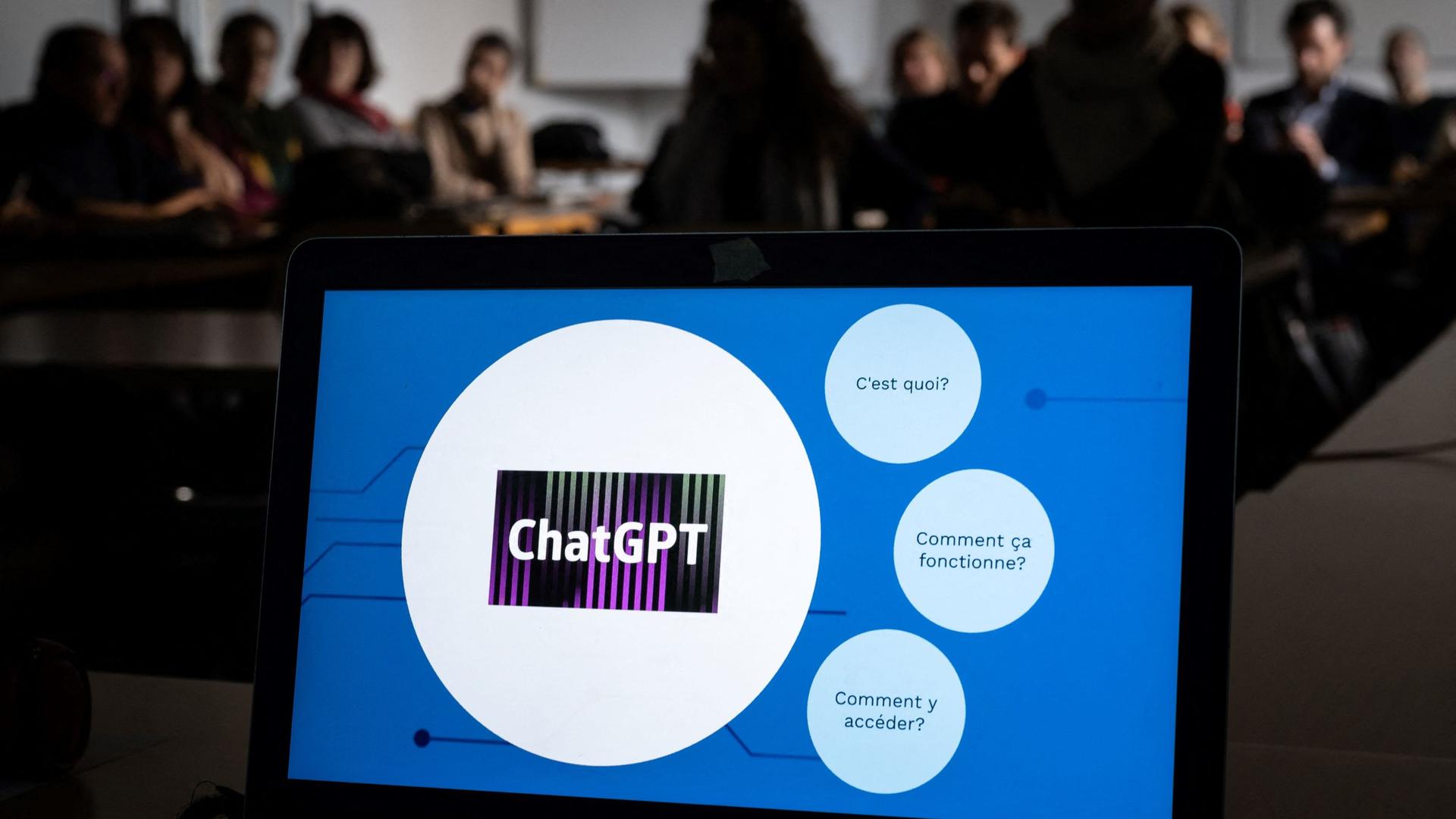 Teachers are seen behind a laptop during a workshop on ChatGpt bot organised for by the School Media Service (SEM) of the Public education of the Swiss canton of Geneva, on February 1, 2023. (Photo by Fabrice COFFRINI / AFP)
