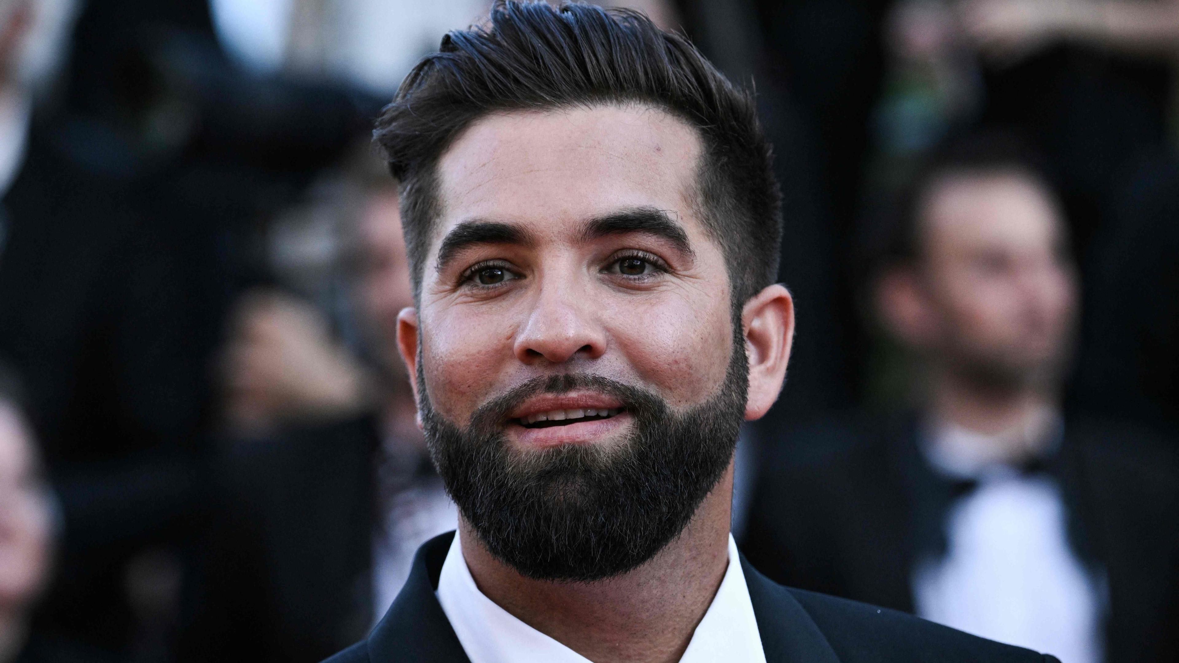 (FILES) French singer Kendji Girac arrives for the screening of the film "Armageddon Time" during the 75th edition of the Cannes Film Festival in Cannes, southern France, on May 19, 2022. French singer Kendji Girac, seriously injured by a gunshot, is between life and death, a source close to the case told AFP on April 22, 2024. (Photo by LOIC VENANCE / AFP)