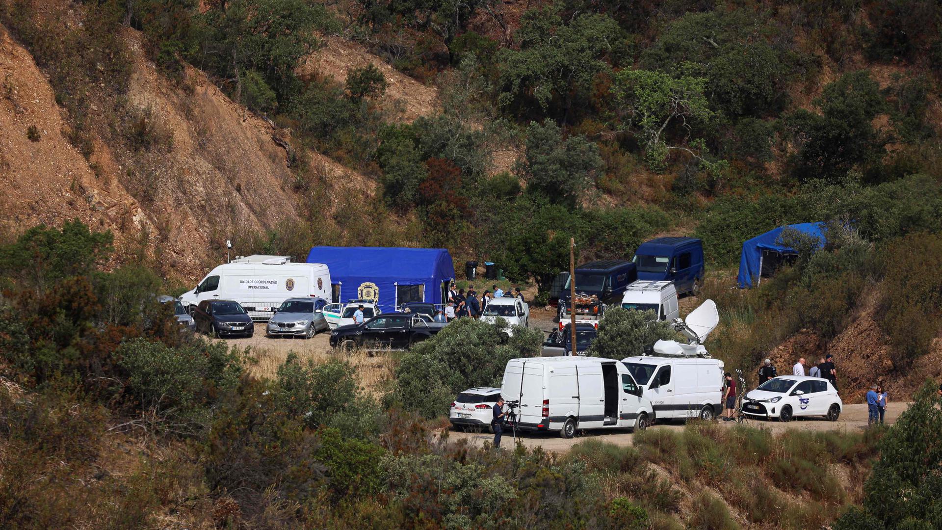 Portuguese authorities from the Judicial Police (PJ) criminal investigation unit work during a new search operation amid the investigation into the disappearance of Madeleine McCann (Maddie) at the Arade dam, in Silves, near Praia da Luz, on 23 May, 2023. This operation stems from a European Investigation Order addressed by the German authorities to Portugal and focuses on the Arade dam, located about 50 kilometers from Praia da Luz, the place where the child disappeared in May 2007, 16 years ago, while on vacation with her parents. (Photo by FILIPE AMORIM / AFP)